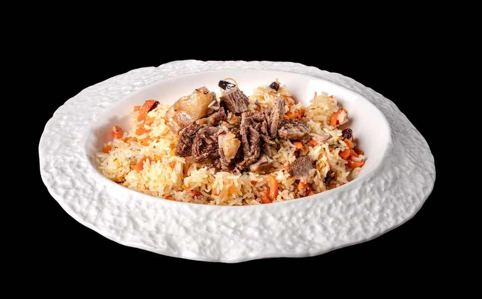 Uyghur polo — rice slow-cooked with lamb, carrots and onion at Dolan's
